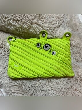 Bright Neon Green Monster Pencil Case with Playful Eye Accents
02-13